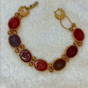 Carved genuine stone beads and gold tone bracelet